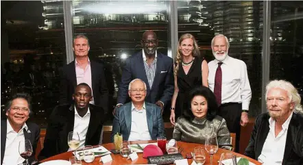  ??  ?? VVIP guests: Najib and his wife Datin Seri Rosmah Mansor at the Nobu Restaurant with (seated from left ) Pemandu president and CEO Datuk Seri Idris Jala, Olympian gold medallist Usain Bolt and Virgin group founder Sir Richard Branson. (Standing from...