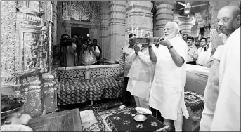  ?? PTI ?? Prime Minister Narendra Modi and BJP president Amit Shah offer prayers at Somnath Temple on Wednesday.