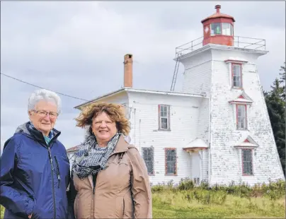  ?? KATIE SMITH/THE GUARDIAN ?? Marie Stretch and Carol Carragher, members of the Blockhouse Lighthouse Preservati­on Society, want the lighthouse repaired before winter so it doesn’t undergo any more damage.
