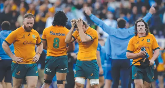  ?? Picture: Timothy Rogers/Getty Images ?? Tate McDermott holds his head in his hands after Australia suffers a loss to Italy in Florence.