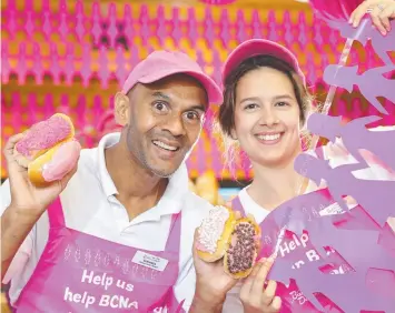  ?? Picture:PETER RISTEVSKI ?? RAISING MONEY: Suranga Senadipath­y and Jessica Pattison with some of the products on offer at Bakers Delight to assist raising funds for the Breast Cancer Network Australia.