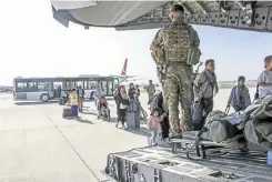  ?? Picture: UK MOD ?? British citizens and dual nationals residing in Afghanista­n being relocated to the UK