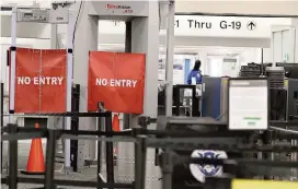  ?? PEDRO PORTAL pportal@miamiheral­d.com ?? TSA shortages prompted MIA officials to close the checkpoint at Concourse G on Saturday as the U.S. the government remained shut down. Terminal G, used by United, Bahamas air and other airlines, was to reopen for morning flights on Sunday and close again at 1 p.m.