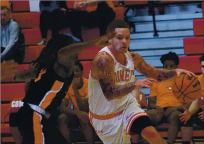  ?? OLIVET COLLEGE ATHLETICS — COURTESY PHOTOS ?? Santa Cruz High alum Chris Martin drives for the Olivet College men’s basketball team in a 2019 game against Anderson. Martin is averaging 10.3 points per game in 12 games played.