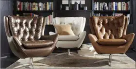  ?? POTTERY BARN VIA AP ?? This undated photo provided by Pottery Barn shows the Wells swivel chair by Pottery Barn. With a nod to mid-century modern style, the Wells swivel chair incorporat­es classic detailing like tufting and the wing silhouette.