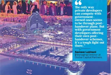  ?? Gulf News Archives ?? Managing Director at Global Capital Partners Visitors looking at Madinat Jumeirah Living project by Dubai Holdings at Cityscape Global at Dubai World Trade Centre last year.