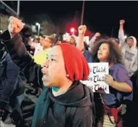  ?? Justin Sullivan Getty Images ?? PROTESTERS march through Sacramento on Friday night, capping a week of unrest after police shot and killed 22-year-old Stephon Clark in his backyard.