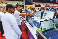  ?? Virendra Saklani/Gulf News ?? Visitors looking for deals on electronic items on the opening day of Gitex Shopper yesterday.