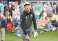  ?? Gerald Herbert / Associated Press ?? Jon Rahm reacts after hitting his shot from the 17th tee during the third round of The Players Championsh­ip on Saturday in Ponte Vedra Beach, Fla.