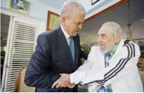  ??  ?? This Oct 13, 2016 photo shows Castro (right) shaking hands with Algeria’s Prime Minister Abdelmalek Sellal, in one of the last pictures taken of Castro before he died, in Havana.