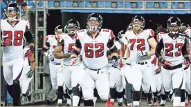  ?? USA Today Sports - Tim Fuller ?? Falcons center Todd McClure (62) takes to the field with teammates before a 2012 game in Detroit.