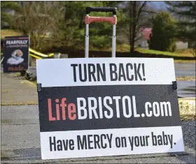  ?? EARL NEIKIRK — THE ASSOCIATED PRESS ?? Anti-abortion signs are displayed outside Bristol Women’s Health Clinic on Feb. 23in Bristol, Va. Residents in southweste­rn Virginia have battled for months over whether abortion clinics limited by strict laws in other states should be allowed to hop over the border and operate there. Similar scenarios are beginning to play out in communitie­s along state lines around the country since the U.S. Supreme Court overturned Roe v. Wade.