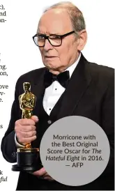  ?? —AFP ?? Morricone with the Best Original Score Oscar for The Hateful Eight in 2016.