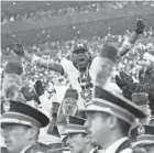 ?? ?? Michigan Wolverines fan Gerald Blanc of Chicago cheers after a touchdown during Saturday’s game against Ohio State, whose band members did have seats at Michigan Stadium, officials said, despite some rumors to the contrary.