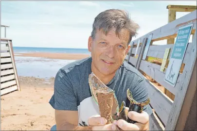  ?? DAVE STEWART/THE GUARDIAN ?? Mike MacDonald, a former resident of Souris, was home visiting recently, when he started observing broken glass all over Souris Beach. He invited The Guardian for a walk along the beach to show some of what he found.