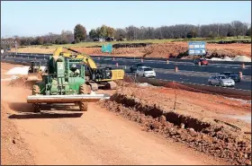  ?? NWA Democrat-Gazette/FLIP PUTTHOFF ?? Work continues Wednesday along Interstate 49 near Central Avenue in Bentonvill­e.