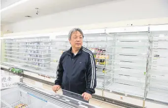  ?? Noriko Hayashi, © The New York Times Co. ?? Mitoshi Matsumoto at his 7-Eleven store in Osaka, Japan, on Jan. 4. In December, the company severed Matsumoto’s contract after he decided to close his shop on New Year’s Day, Japan’s most important holiday.