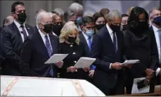  ?? EVAN VUCCI / AP ?? President biden, first lady Jill biden, former President barack obama and former first lady michelle obama stand at the funeral for former secretary of state Colin Powell.