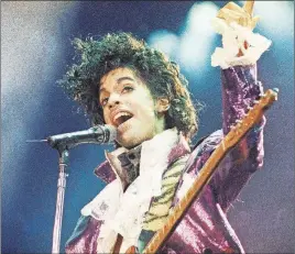  ?? AP PHOTO ?? Prince performs at the Forum in Inglewood, Calif in 1985. A doctor who saw Prince in the days before he died had prescribed oxycodone under the name of Prince’s friend to protect the musician’s privacy, according to court documents unsealed Monday