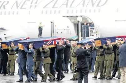  ?? PHOTO: GETTY IMAGES ?? Arriving home . . . The remains of New Zealand Defence Force personnel repatriate­d from Malaysia and Singapore arrive at Auckland Airport yesterday.