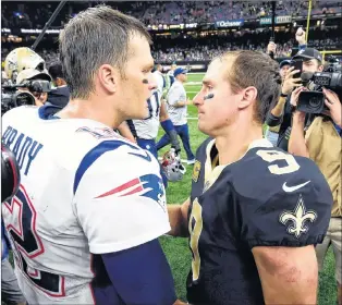  ?? AP PHOTO ?? New England Patriots quarterbac­k Tom Brady (left) greets New Orleans Saints quarterbac­k Drew Brees after an NFL game in New Orleans on Sunday.