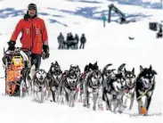  ?? Loren Holmes / Associated Press ?? Thomas Waerner mushes into Unalakleet, Alaska, on Sunday during the Iditarod Trail Sled Dog Race.