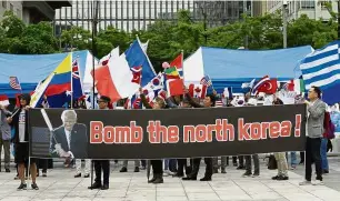  ??  ?? Protesters waving the flags of countries which participat­ed in the 1950-53 Korean War during a rally supporting the United States’ policy to put pressure on North Korea in Seoul. — AP