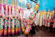  ?? — Bernama photo ?? Ong showing a dragon joss stick at his factory at Kubang Semang.-Bernama photoanged along 3.35 kilometres.
