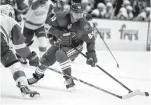  ?? STACIE SCOTT/AZCENTRAL SPORTS ?? Coyotes center Mike Ribeiro works the puck down the ice during Saturday night’s game against the Red Wings at Jobing.com Arena.