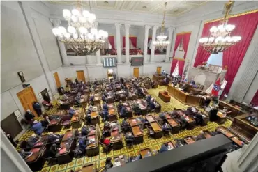  ?? AP PHOTO/ MARK HUMPHREY ?? Members of the Tennessee House of Representa­tives conduct business on the first day of the legislativ­e session Tuesday in Nashville.