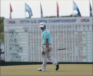  ?? AP PHOTO/DAVID J. PHILLIP ?? Brian Harman looks over a putt on the 18th hole during the second round of the U.S. Open golf tournament Friday at Erin Hills in Erin, Wis.