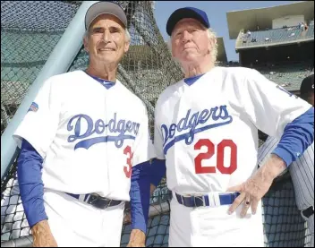  ?? ASSOCIATED PRESS FILES ?? Hall of Fame and former Los Angeles Dodgers pitchers Don Sutton (right) and Sandy Koufax visit during the 2013 Old-Timers game at Dodger Stadiium. Sutton, who spent most of his career in a Los Angeles Dodgers’ rotation that included Koufax and Don Drysdale, died Tuesday at age 75.