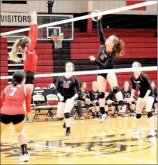  ?? Staff photograph by Mark Humphrey ?? Lady Blackhawk senior Cassy Porter smashes a hit over the net during the consolatio­n match with the Farmington Lady Cardinals at 4A-1 District tournament hosted by Pea Ridge on Thursday, Oct. 18. Pea Ridge swept the Lady Cardinals, 25-10, 25-22, 26-24, to claim third place. The Lady Blackhawks qualified for state taking on Brookland Tuesday, Oct. 23, in the tourney’s first-round at Mena.