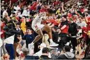  ?? Greg Fiume/Tribune News Service ?? Julian Reese and Maryland handed No. 3 Purdue its second straight loss, beating the Boilermake­rs 68-54.