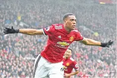  ?? — AFP photo ?? Manchester United's French striker Anthony Martial celebrates after scoring the opening goal of the English Premier League football match between Manchester United and Tottenham Hotspur at Old Trafford in Manchester, north west England, on October 28,...