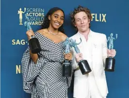  ?? FRAZER HARRISON/GETTY ?? Ayo Edebiri and Jeremy Allen White, who star together in “The Bear,” hold their trophies Feb. 24 during the Screen Actors Guild Awards in Los Angeles.