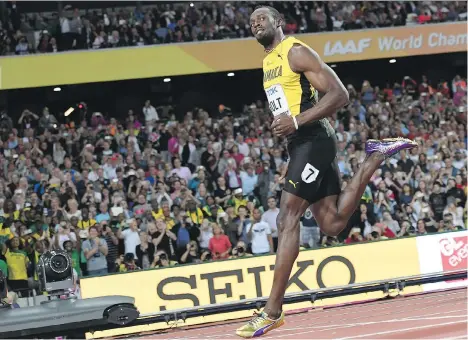  ?? KIRILL KUDRYAVTSE­V/AFP/GETTY IMAGES ?? Jamaica’s Usain Bolt cruised to a time of 10.07 seconds to easily win his heat of the men’s 100-metre race at the 2017 World Championsh­ips at London Stadium in England on Friday. The men’s 100-metre semifinals and finals take place Saturday.