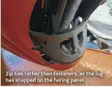  ?? ?? Zip ties rather than fasteners, as the lug has snapped on the fairing panel