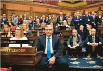  ?? HARTFORD COURANT ?? Legislator­s, including Len Fasano, center, listen as Gov. Ned Lamont delivers the 2020 State of the State.