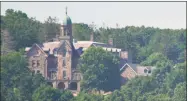  ?? Josh LaBella / Hearst Connecticu­t Media ?? The former Mount Saint John School in Deep River, which was operated by the Norwich Diocese, is the subject of dozens of lawsuits claiming alleged sexual abuse of minors by clergy and staff.