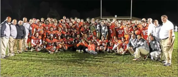  ?? SAM STEWART - DIGITAL FIRST MEDIA ?? The Perkiomen Valley football team poses with the league championsh­ip plaque after defeating Pottsgrove to repeat as PAC champion Friday night.