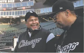  ?? Nancy Stone / Associated Press ?? Nevest Coleman (left) smiles as fellow grounds crew member and friend Harry Smith Jr. shows some newer features of Guaranteed Rate Field in Chicago.