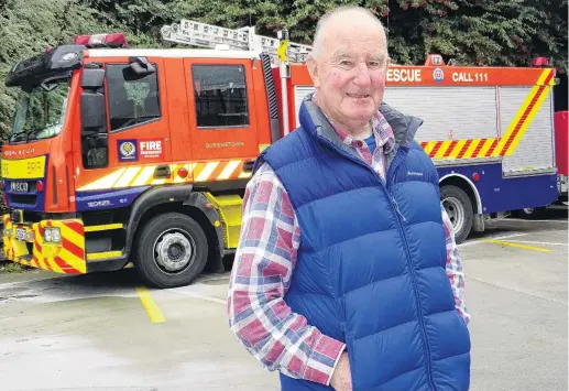  ?? PHOTO: TRACEY ROXBURGH ?? Time flies . . . Former Queenstown Volunteer Fire Brigade chief fire officer Bob Robertson (80), whose 60 years’ service to the brigade will be acknowledg­ed in Queenstown tonight.