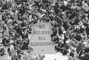  ?? KEVIN LAMARQUE / REUTERS ?? Activists rally inside the Senate Hart Office Building during a protest in opposition to US Supreme Court nominee Brett Kavanaugh and in support of Christine Ford, the university professor who has accused Kavanaugh of sexual assault in 1982, on Capitol Hill in Washington, on Thursday.