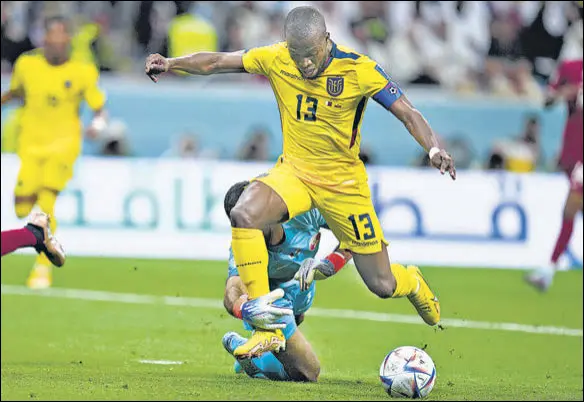  ?? AP ?? Qatar's goalkeeper Saad Al Sheeb brings down Ecuador's Enner Valencia during the opening Group A match of the 2022 World Cup at the Al Bayt Stadium in Al Khor, Qatar on Sunday.