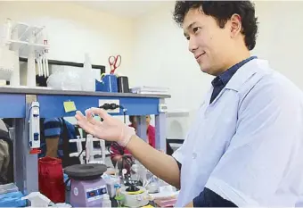  ??  ?? Cynthia Palmes-Saloma (top right) is the director of UP-NIMBB and program director of the DNA Sequencing Facility. The PGC currently offers a full range of DNA sequencing services with facilities including a next-generation sequencing machine (top)...