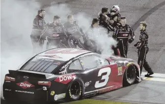  ?? AP PHOTO ?? PARTY TIME: Austin Dillon jumps out of his car and celebrates with his crew after winning the Daytona 500 yesterday.