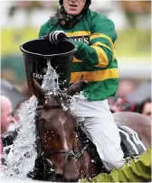  ?? EMPICS ?? Splashing out: McCoy cools off Double Seven after coming third last year
