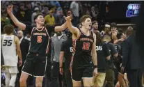  ?? RANDALL BENTON — THE ASSOCIATED PRESS ?? Princeton players Jack Scott (5) and Caden Pierce (12) celebrate near the end of a victory over Arizona in the first round of the NCAA Tournament in Sacramento.