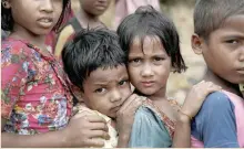  ?? — Reuters ?? Rohingya refugee children queue for aid in Cox’s Bazar, Bangladesh.